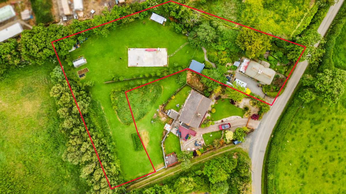 Aerial view of Genista Cottage with the site boundary outlined in red